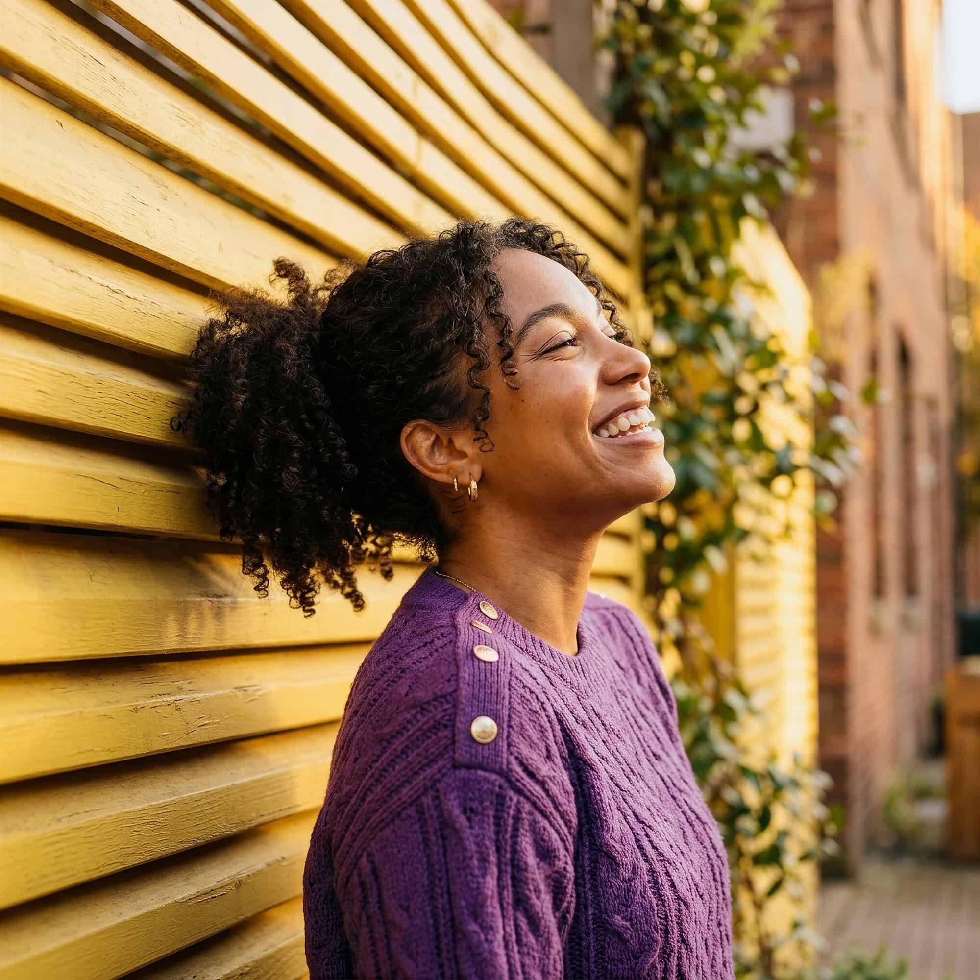 Happy woman smiling outdoors after making progress in addiction treatment in Bowling Green, KY at Redstone Behavioral Health.