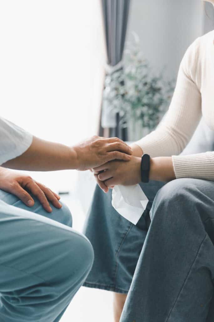 Caring professional providing compassionate support to a client during addiction treatment at Redstone Behavioral Healthin Bowling Green, KY.