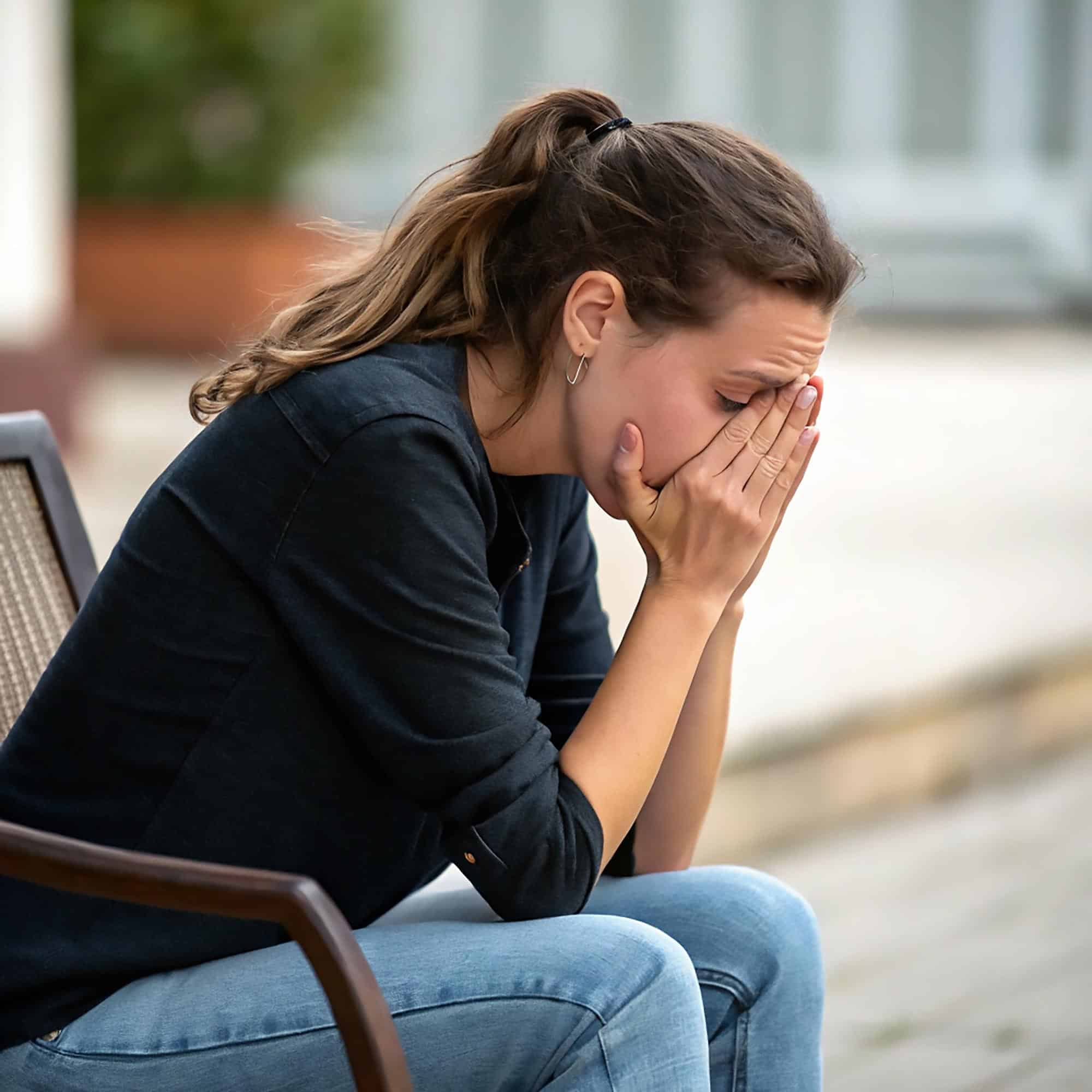Woman experiencing emotional distress while receiving support for co-occurring disorders treatment in Bowling Green at Redstone Behavioral Health.