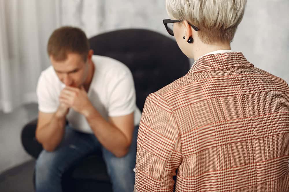 Man speaking with a psychologist about personal challenges during trauma therapy in Bowling Green, KY.